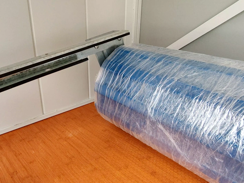 Porte enroulables Boxwell - fixation des coulisses sur le tambour